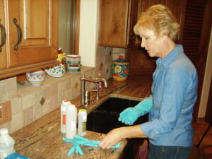 A well owner preparing to sample her well water for testing